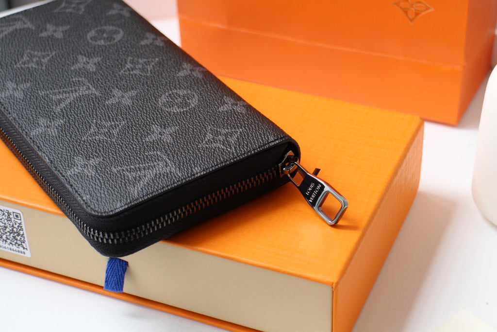 LV 25S ZIPPY WALLET HORIZONTAL 19 IN MONOGRAM ECLIPSE COATED CALFSKIN