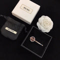 MIUMIU 26S CRYSTAL HEART LOGO HAIR CLIP IN SILVER TONE METAL 617641