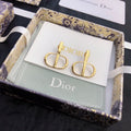 CD 26S LOGO STUD EARRINGS IN GOLD TONE METAL 645628