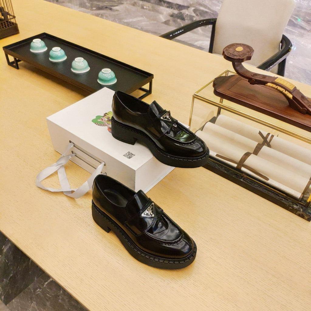 PRADA 26S PENNY LOAFERS 55MM IN DARK GREEN PATENT CALFSKIN