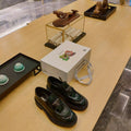 PRADA 26S PENNY LOAFERS 55MM IN GREEN PATENT CALFSKIN