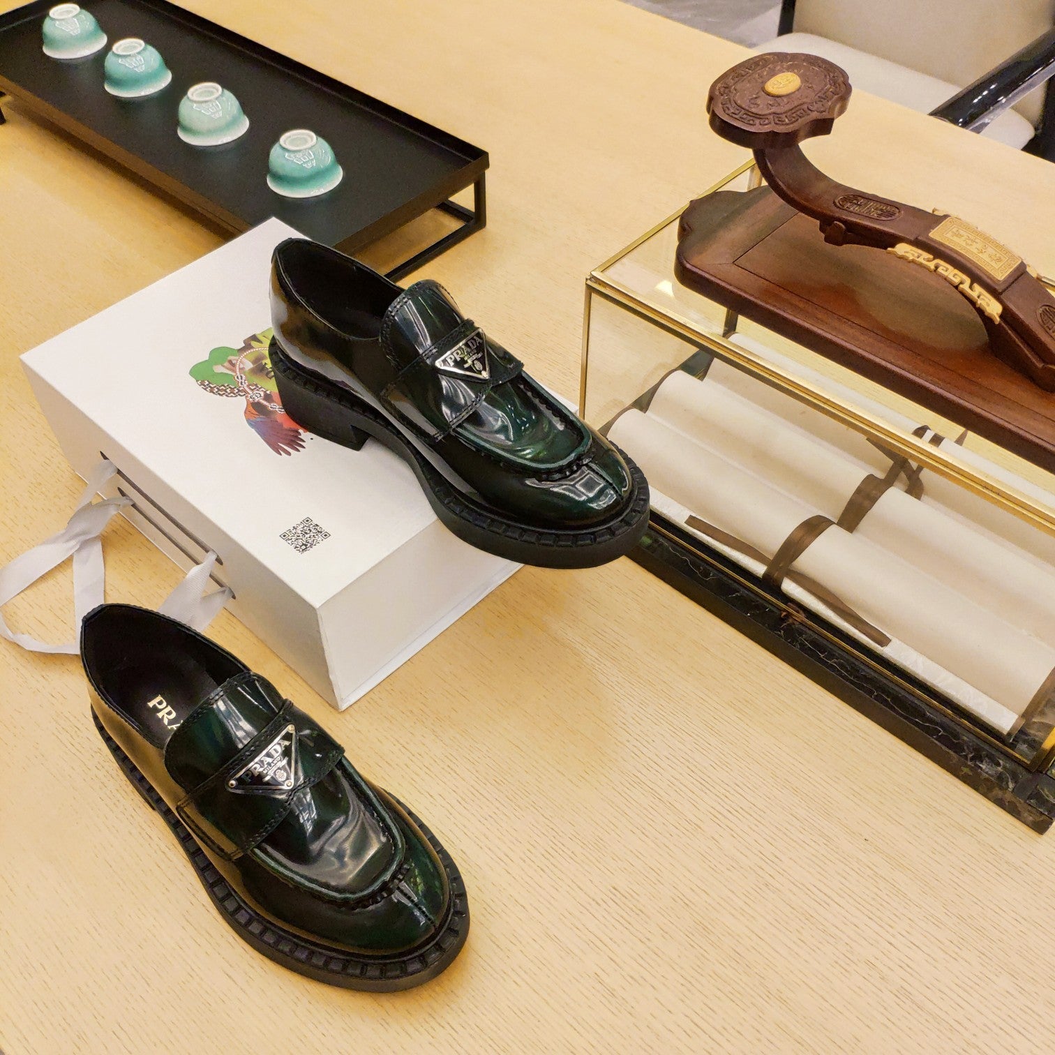 PRADA 26S PENNY LOAFERS 55MM IN GREEN PATENT CALFSKIN