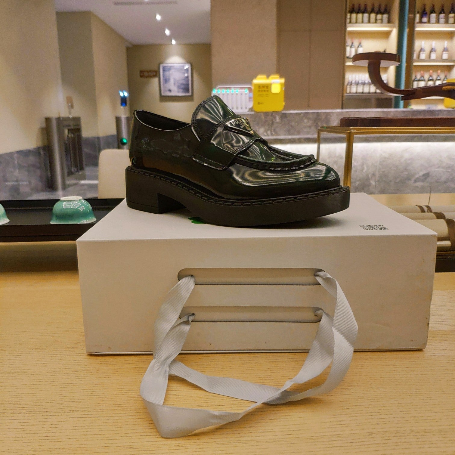 PRADA 26S PENNY LOAFERS 55MM IN GREEN PATENT CALFSKIN