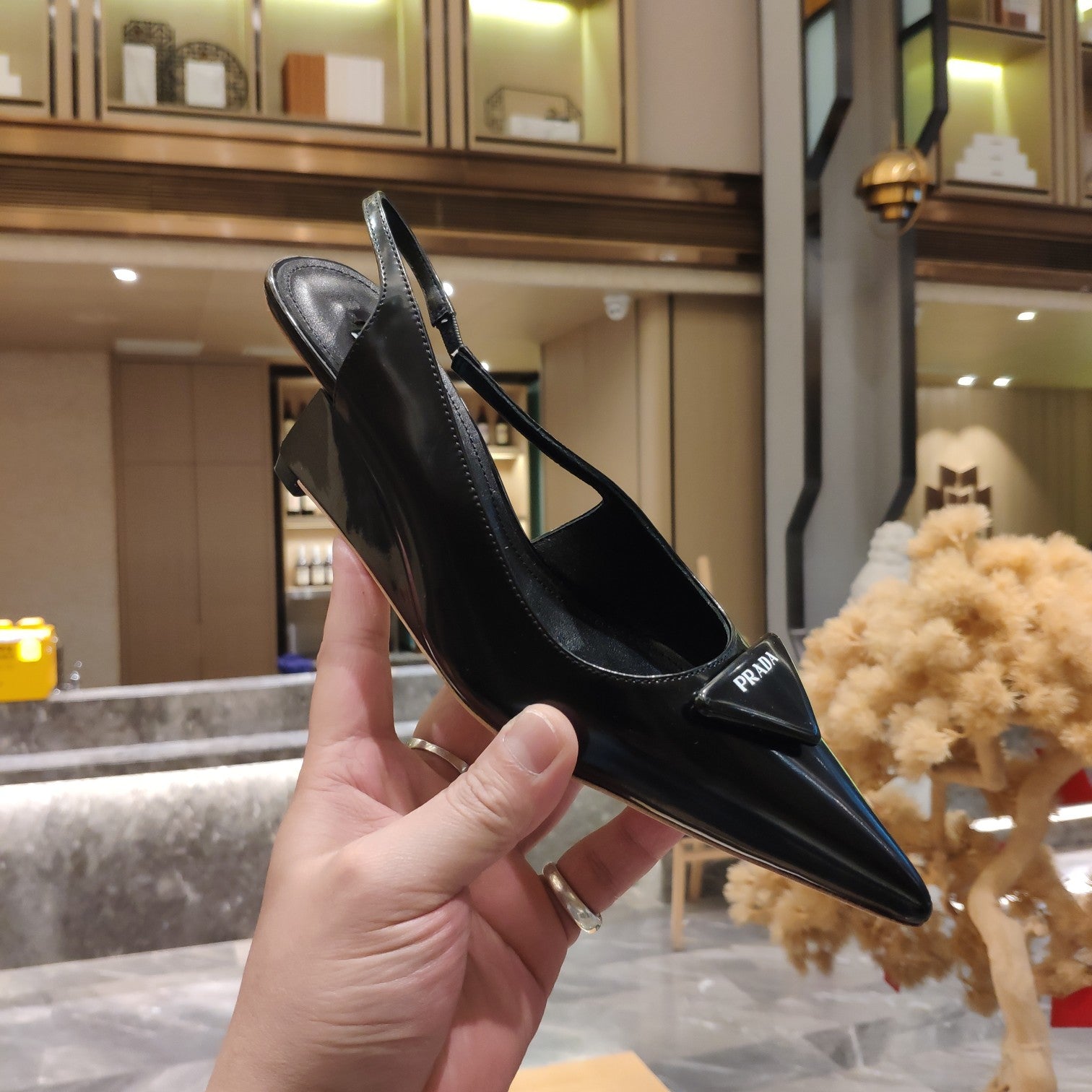 PRADA 26S POINTED TOE WEDGE SLINGBACK PUMPS IN BLACK CALFSKIN