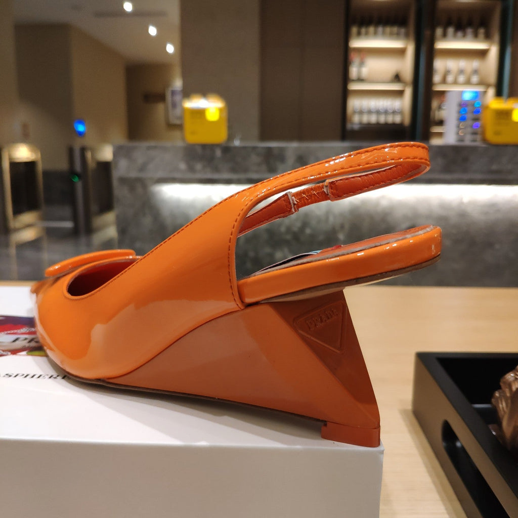 PRADA 26S POINTED TOE WEDGE SLINGBACK PUMPS IN ORANGE PATENT CALFSKIN