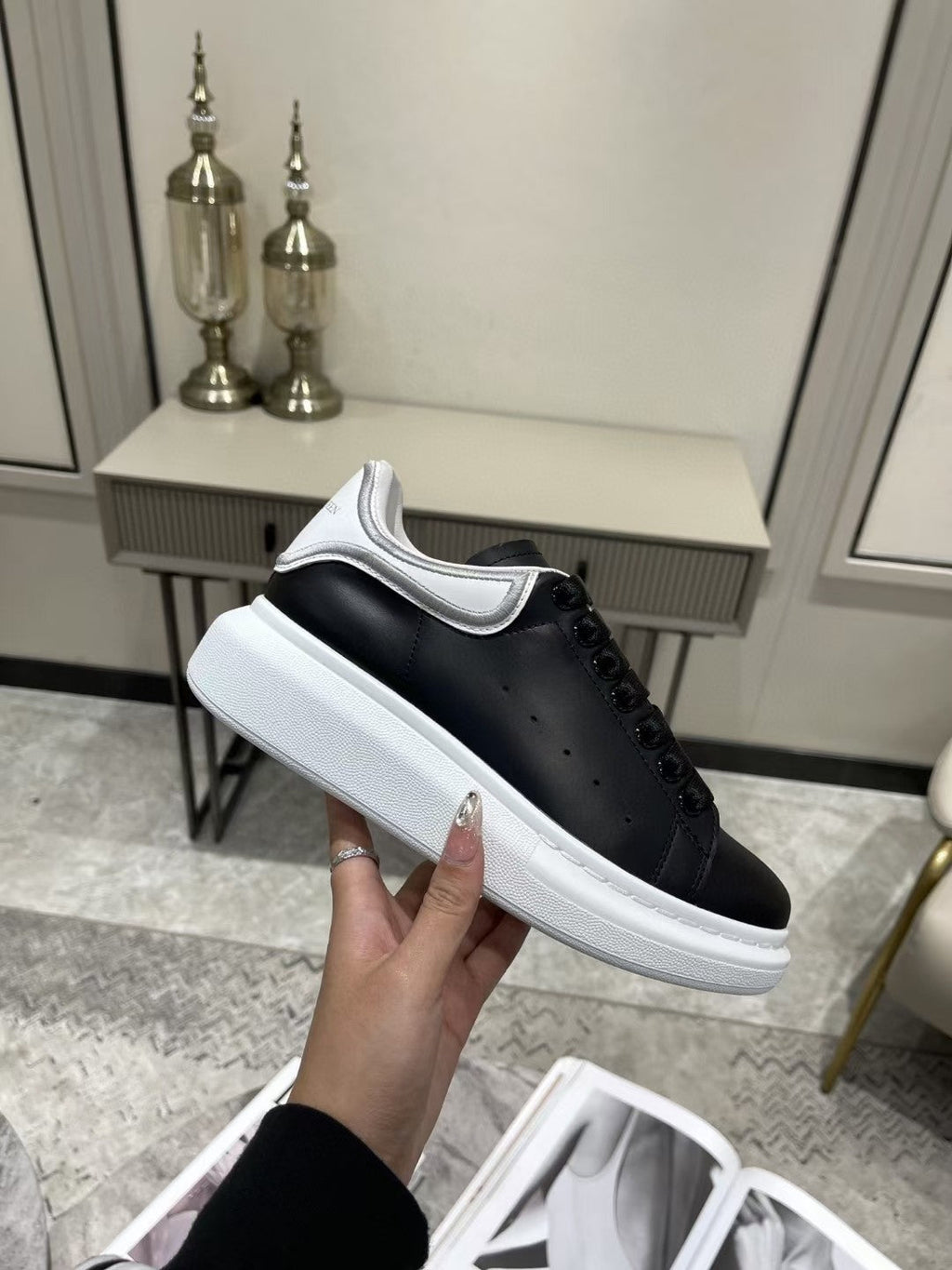 OVERSIZED SNEAKER IN BLACK CALFSKIN WITH SILVER STITCHED WHITE HEEL TAB