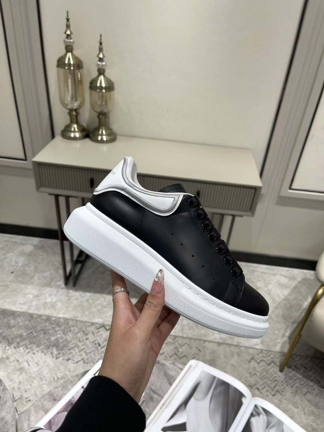 OVERSIZED SNEAKER IN BLACK CALFSKIN WITH SILVER STITCHED WHITE HEEL TAB