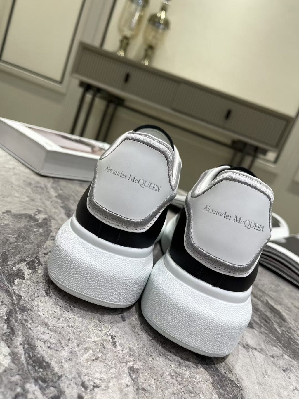 OVERSIZED SNEAKER IN BLACK CALFSKIN WITH SILVER STITCHED WHITE HEEL TAB