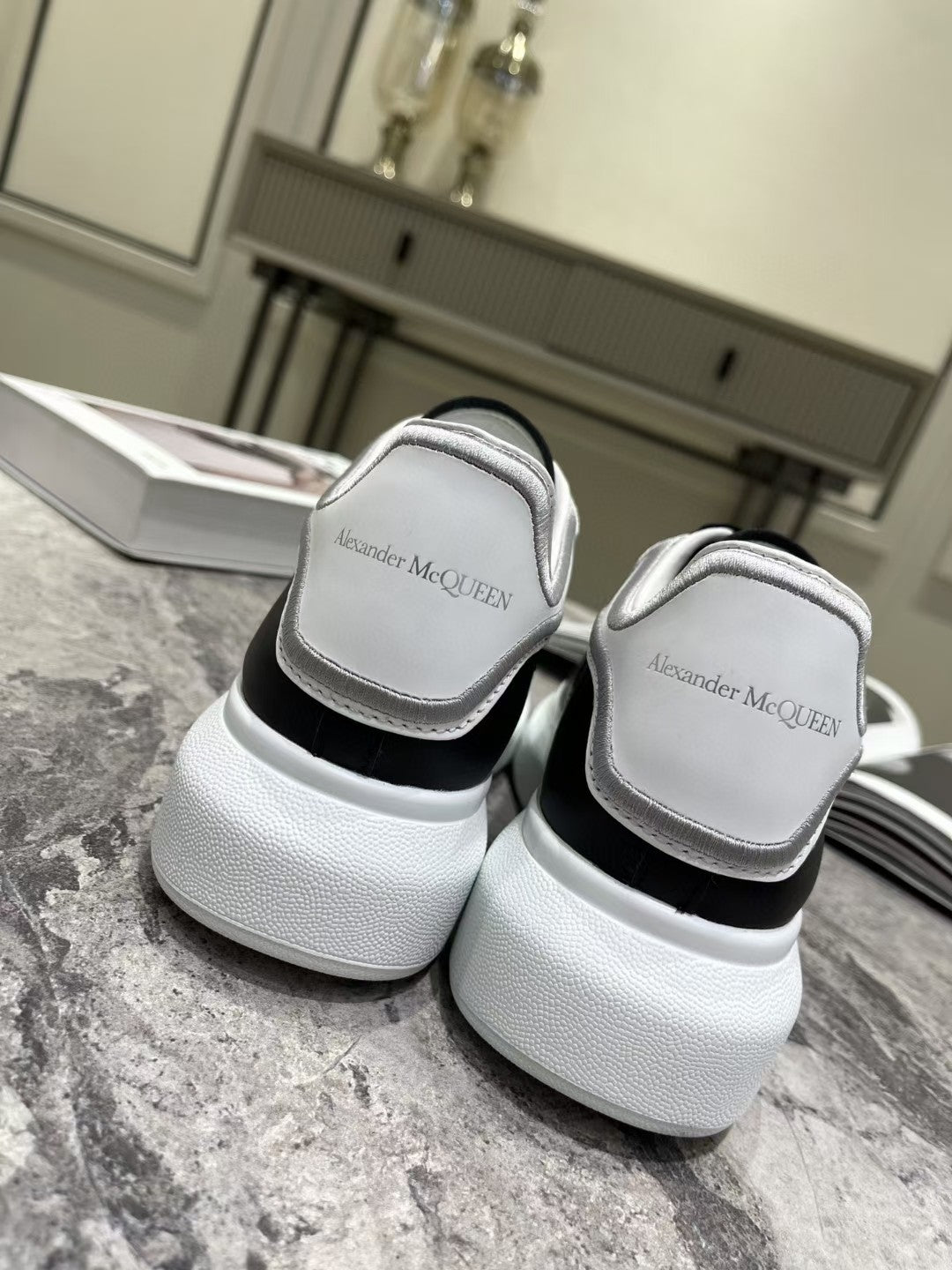OVERSIZED SNEAKER IN BLACK CALFSKIN WITH SILVER STITCHED WHITE HEEL TAB