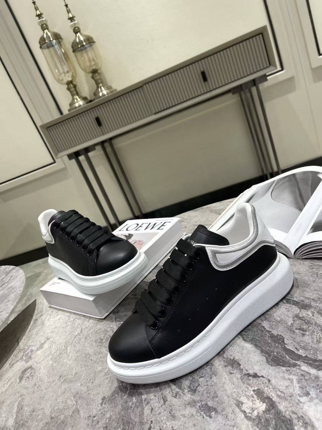 OVERSIZED SNEAKER IN BLACK CALFSKIN WITH SILVER STITCHED WHITE HEEL TAB