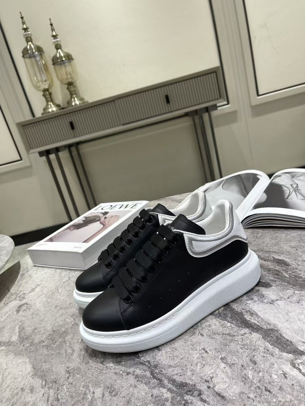 OVERSIZED SNEAKER IN BLACK CALFSKIN WITH SILVER STITCHED WHITE HEEL TAB