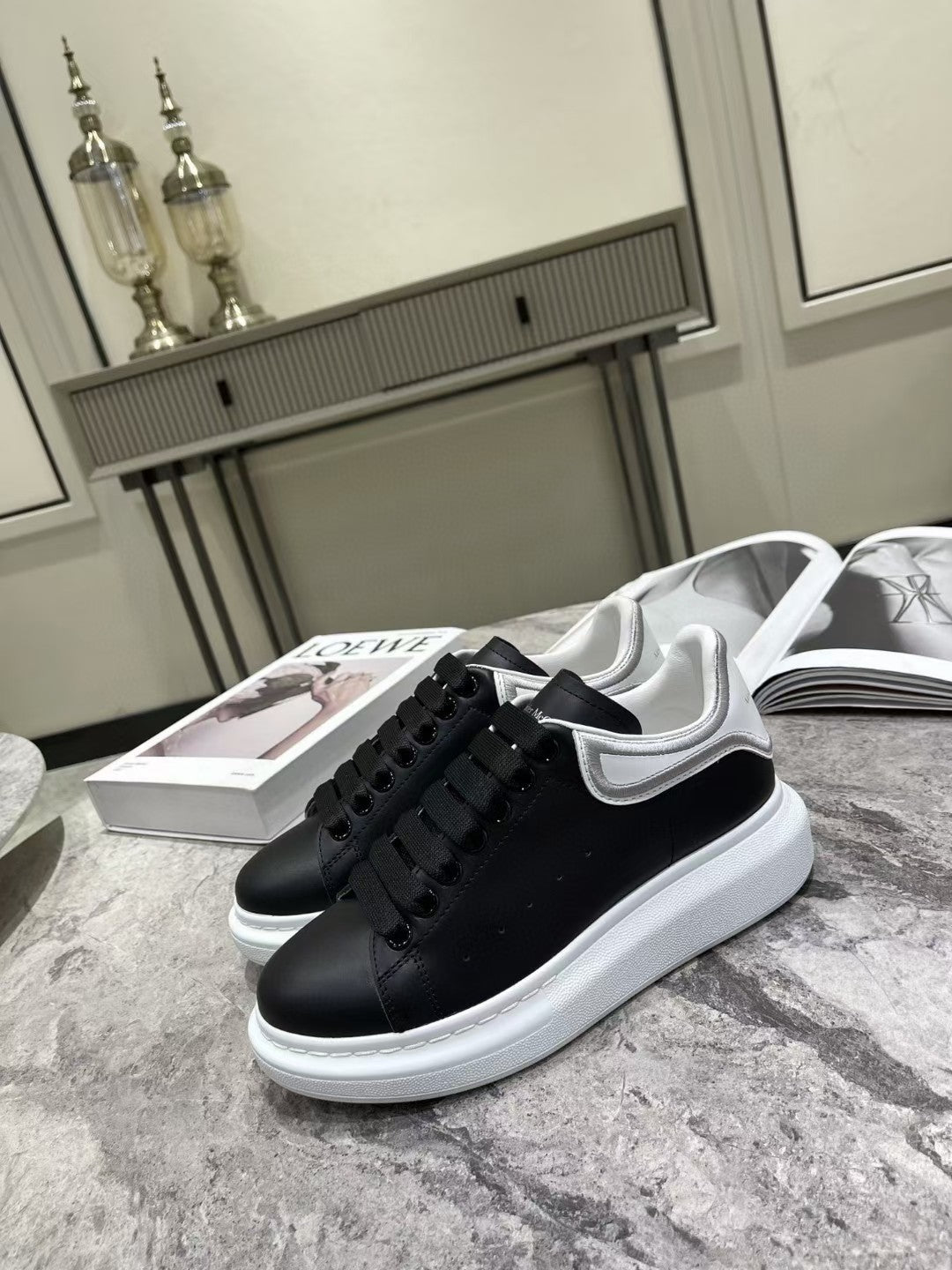 OVERSIZED SNEAKER IN BLACK CALFSKIN WITH SILVER STITCHED WHITE HEEL TAB