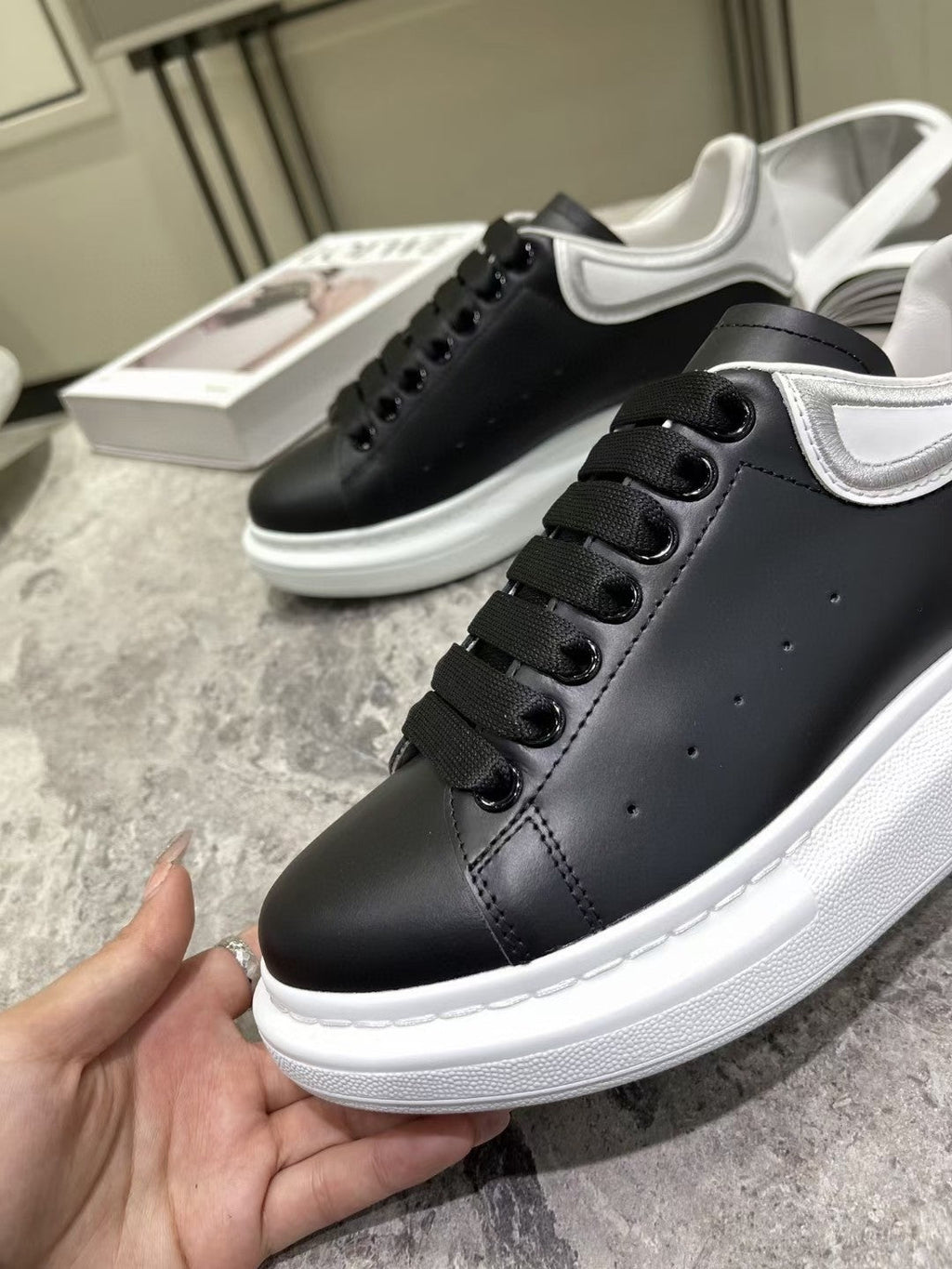 OVERSIZED SNEAKER IN BLACK CALFSKIN WITH SILVER STITCHED WHITE HEEL TAB