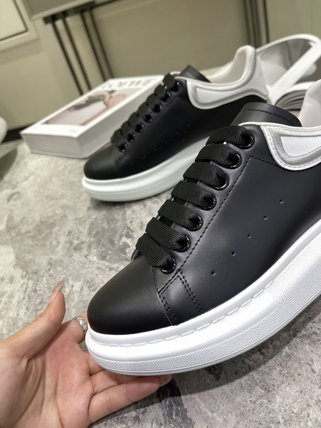 OVERSIZED SNEAKER IN BLACK CALFSKIN WITH SILVER STITCHED WHITE HEEL TAB