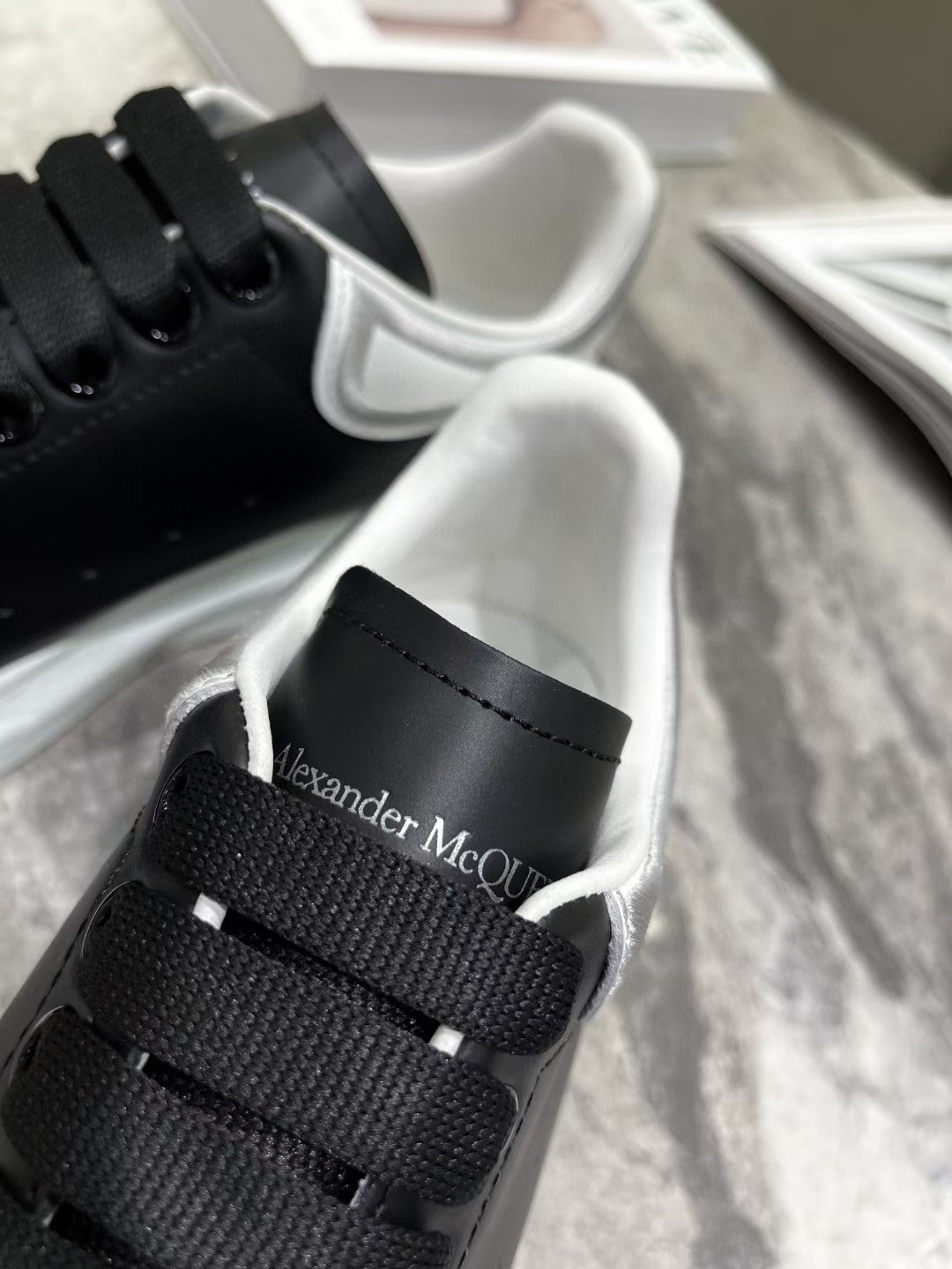OVERSIZED SNEAKER IN BLACK CALFSKIN WITH SILVER STITCHED WHITE HEEL TAB
