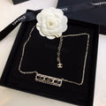 CHANEL 26S CHANEL CC LOGO CRYSTAL TRIM BAR PENDANT NECKLACE WITH BLACK LEATHER IN GOLD METAL 633315