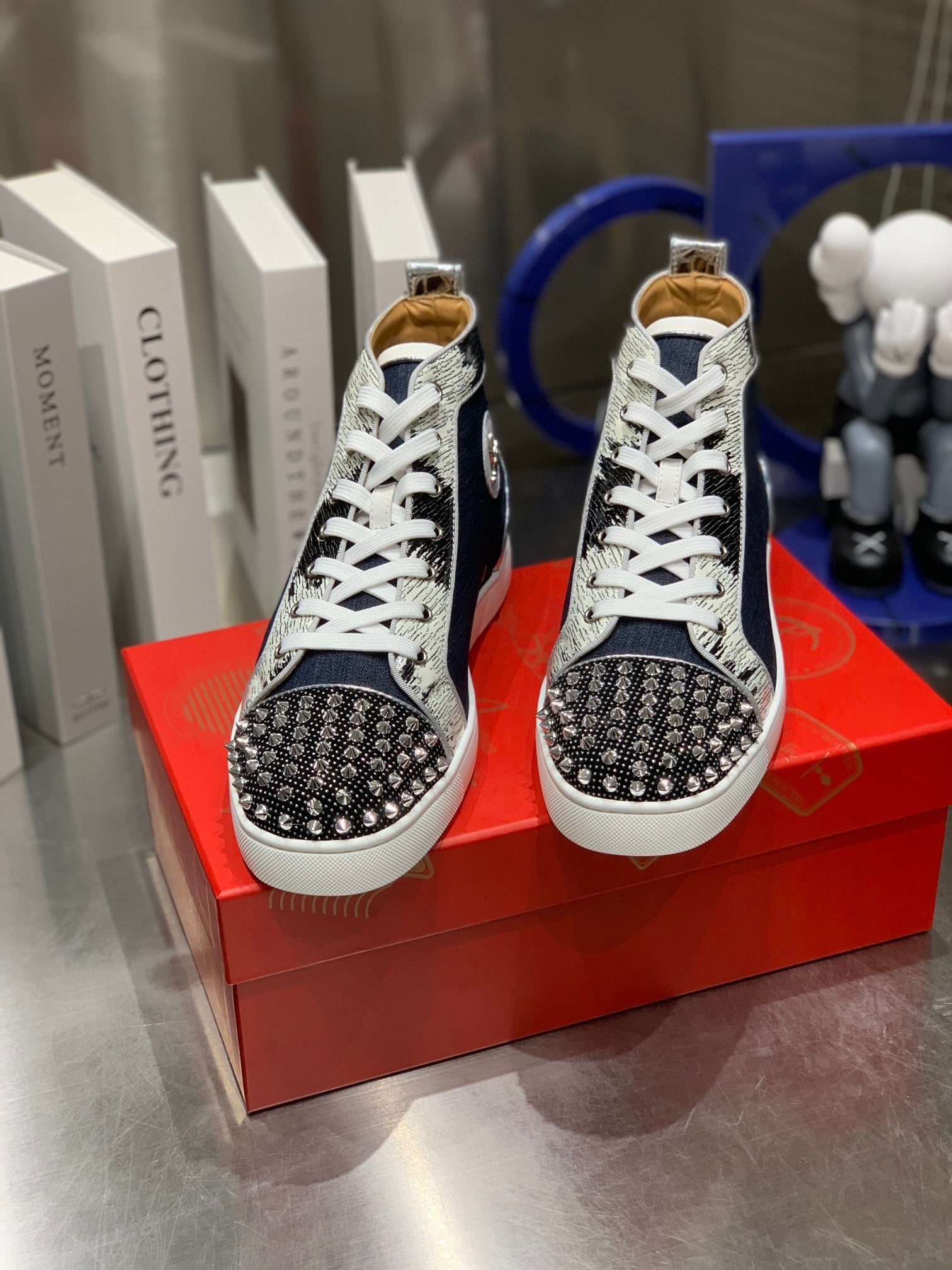 LOU SPIKES STUDDED HIGH-TOP SNEAKERS IN NAVY BLUE FABRIC AND CALFSKIN