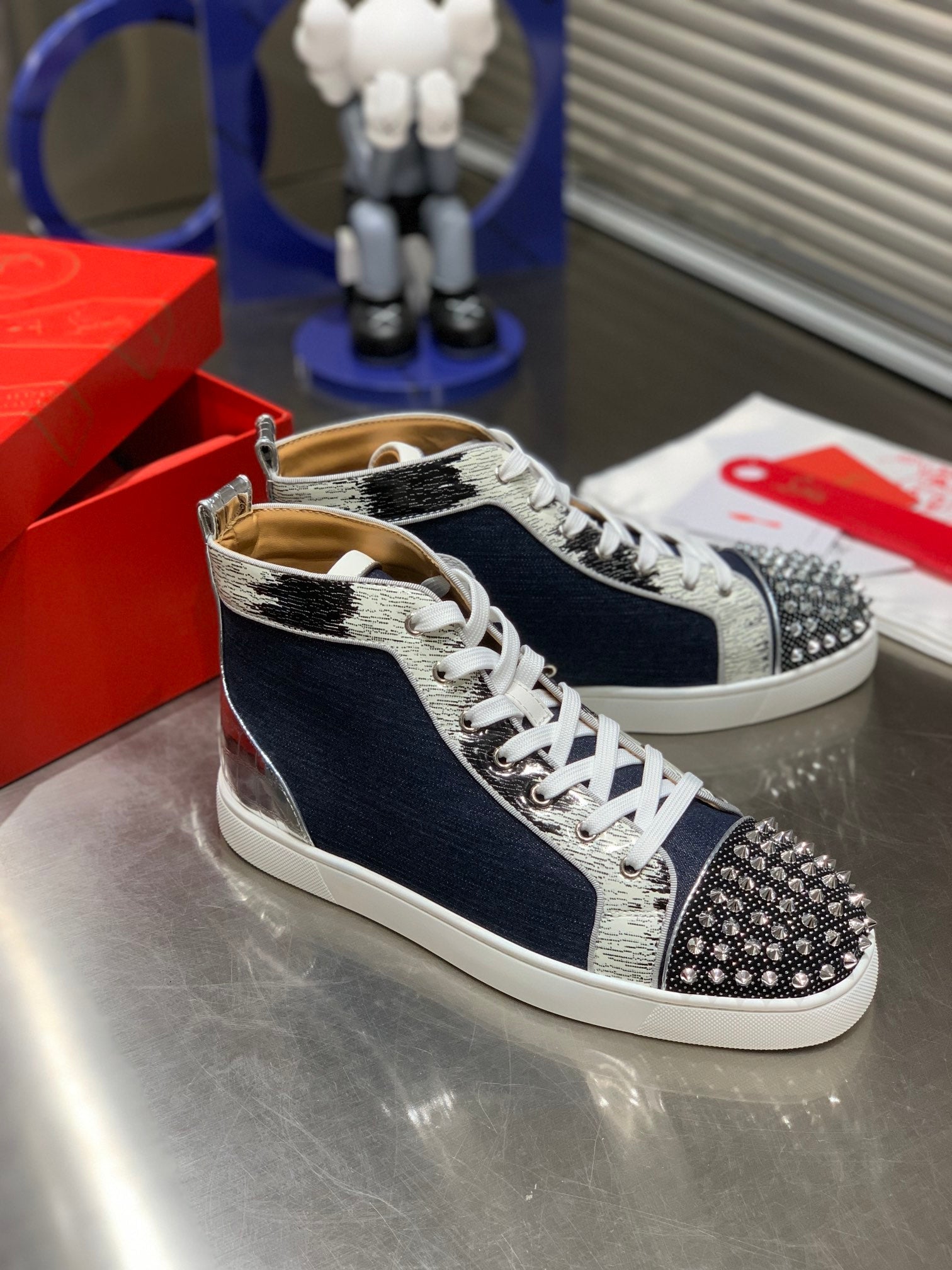 LOU SPIKES STUDDED HIGH-TOP SNEAKERS IN NAVY BLUE FABRIC AND CALFSKIN