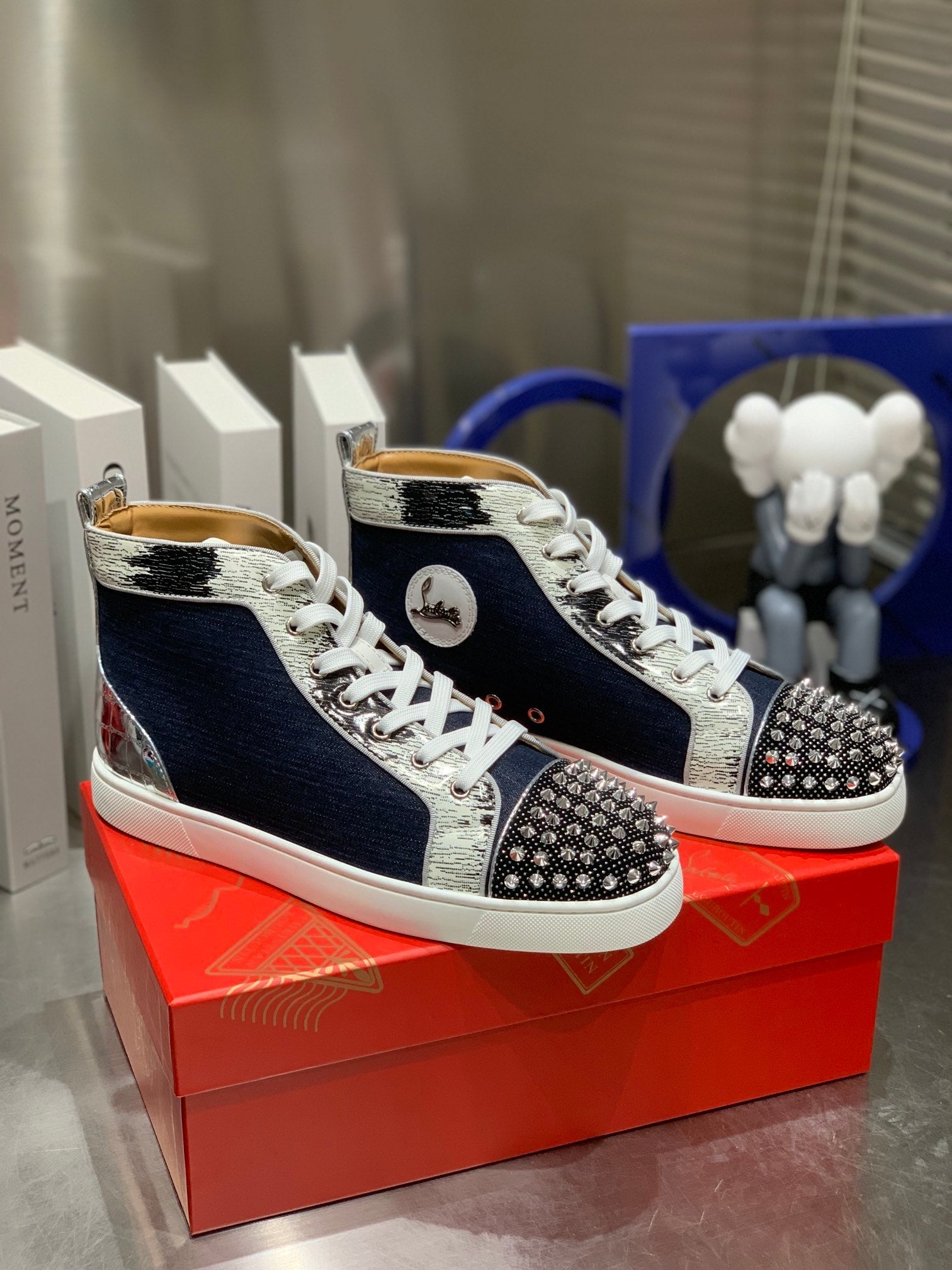 LOU SPIKES STUDDED HIGH-TOP SNEAKERS IN NAVY BLUE FABRIC AND CALFSKIN