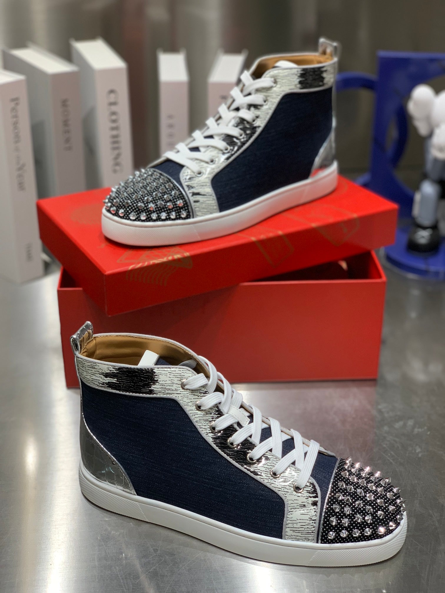 LOU SPIKES STUDDED HIGH-TOP SNEAKERS IN NAVY BLUE FABRIC AND CALFSKIN