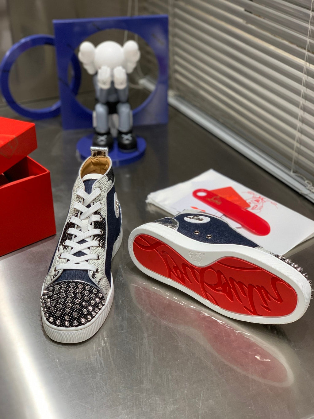 LOU SPIKES STUDDED HIGH-TOP SNEAKERS IN NAVY BLUE FABRIC AND CALFSKIN