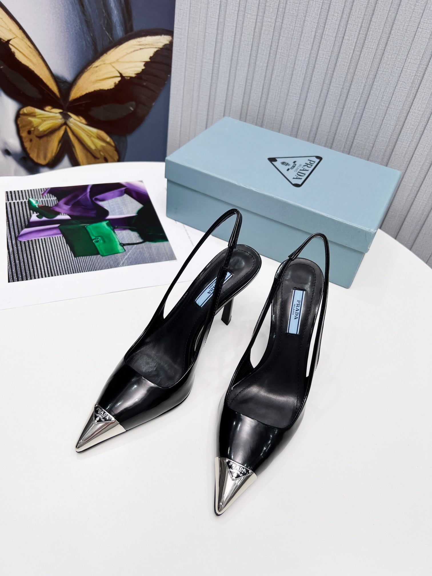 PRADA 26S SLINGBACK HEELS 95MM IN BLACK METAL TIP CALFSKIN