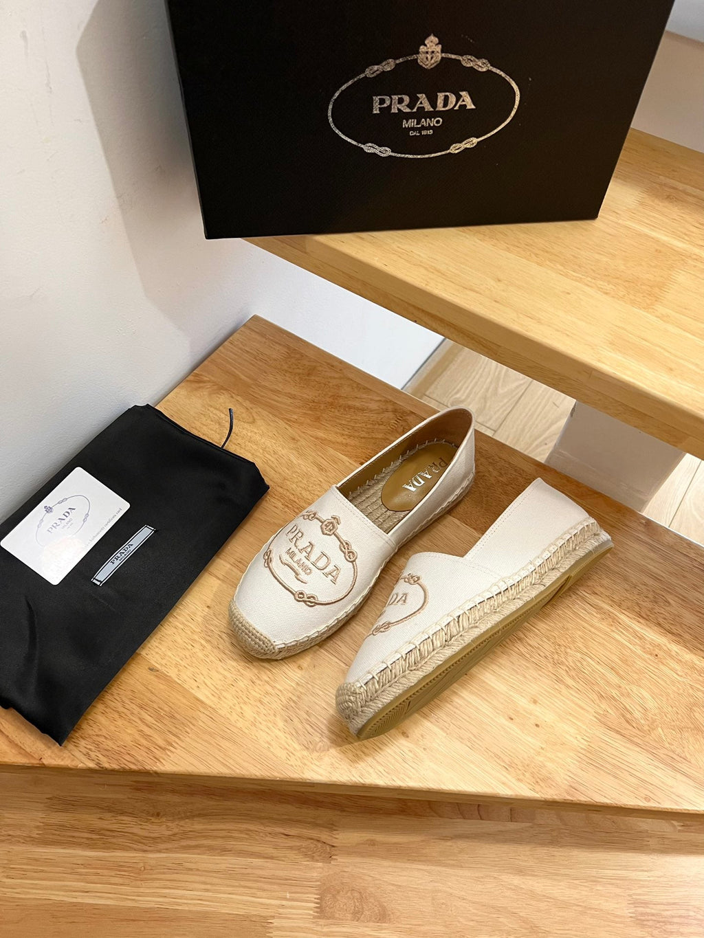 PRADA 26S EMBROIDERED LOGO ESPADRILLE FLATS IN IVORY WHITE CANVAS