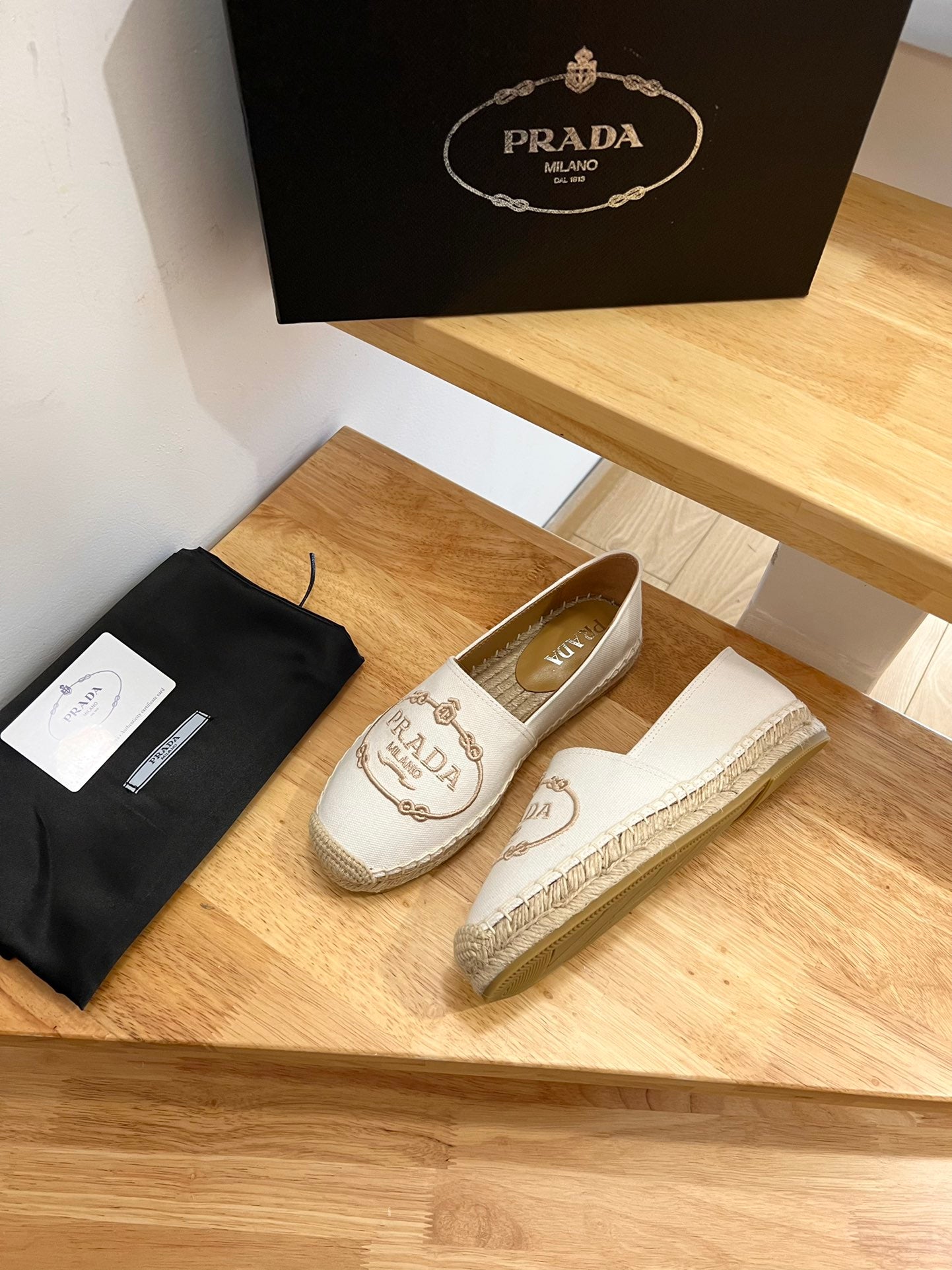 PRADA 26S EMBROIDERED LOGO ESPADRILLE FLATS IN IVORY WHITE CANVAS