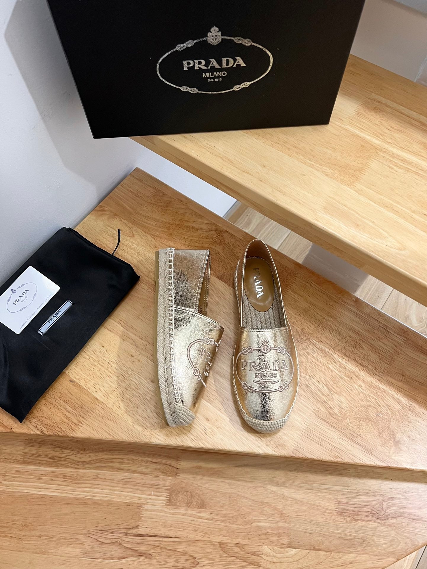 PRADA 26S EMBROIDERED LOGO ESPADRILLE FLATS IN GOLD CALFSKIN