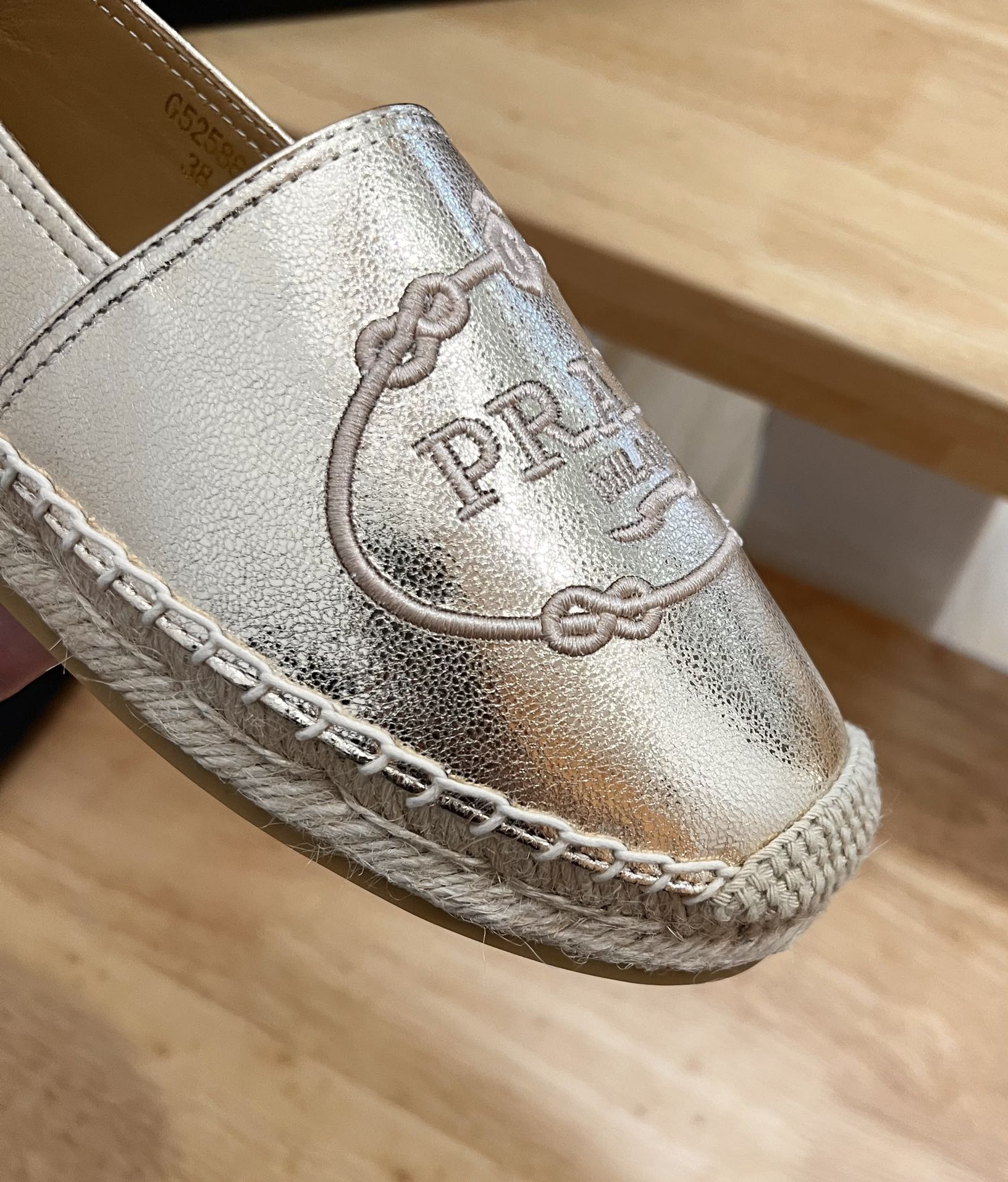 PRADA 26S EMBROIDERED LOGO ESPADRILLE FLATS IN GOLD CALFSKIN