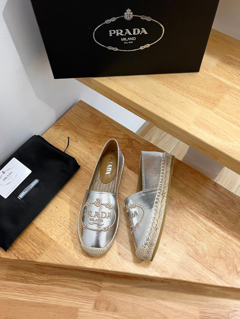 PRADA 26S EMBROIDERED LOGO ESPADRILLE FLATS IN SILVER CALFSKIN