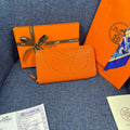 HM SILK'IN HOLED WALLET 19 ORANGE CALFSKIN