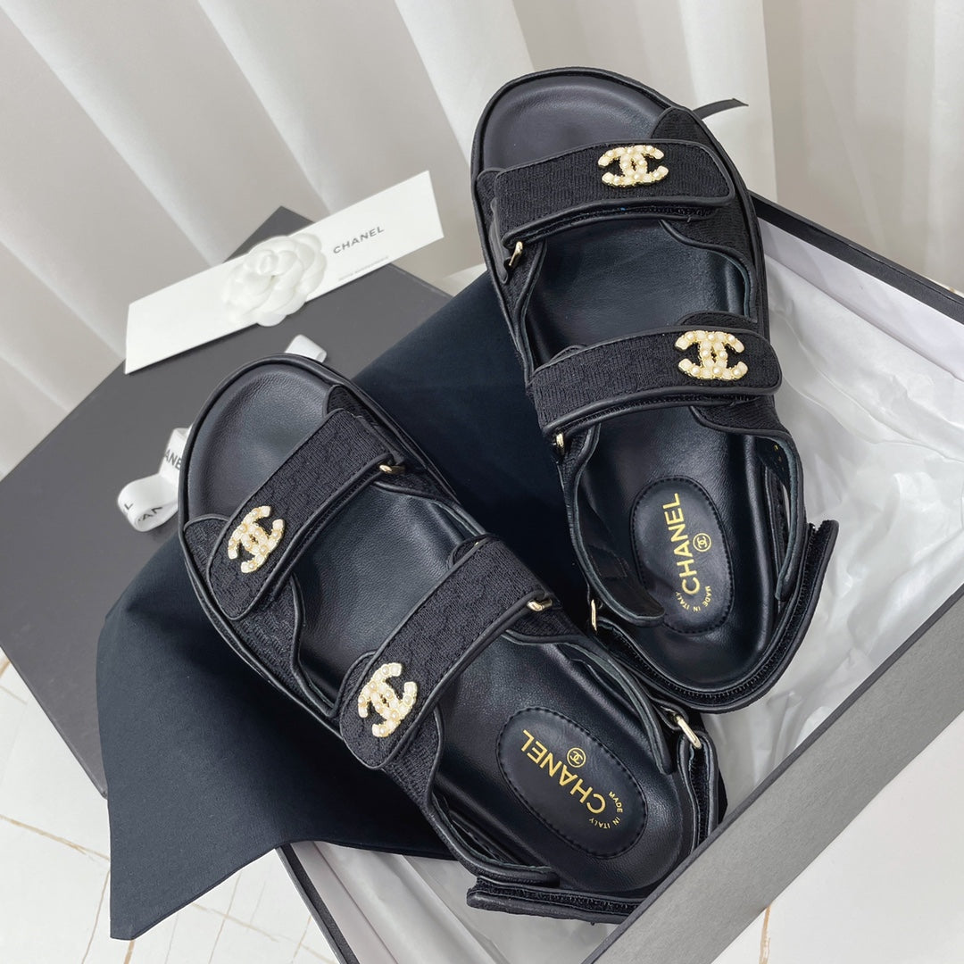 CHANEL 26S SANDALS IN BLACK FABRIC WITH PEARL-EMBELLISHED LOGO