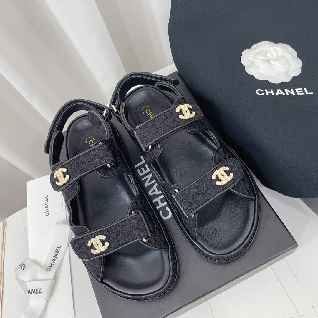 CHANEL 26S SANDALS IN BLACK FABRIC WITH PEARL-EMBELLISHED LOGO