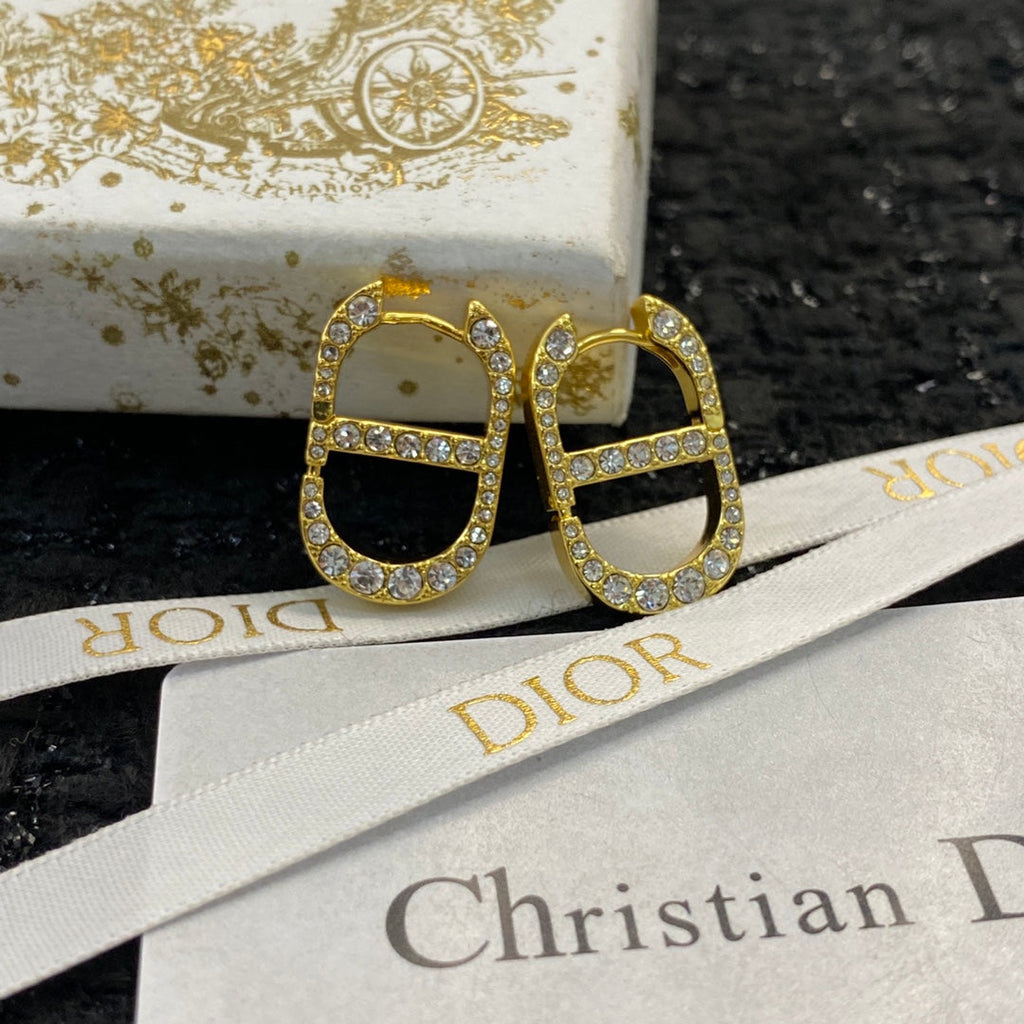 CD 26S CRYSTAL LOGO STUD EARRINGS IN GOLD TONE METAL 646502