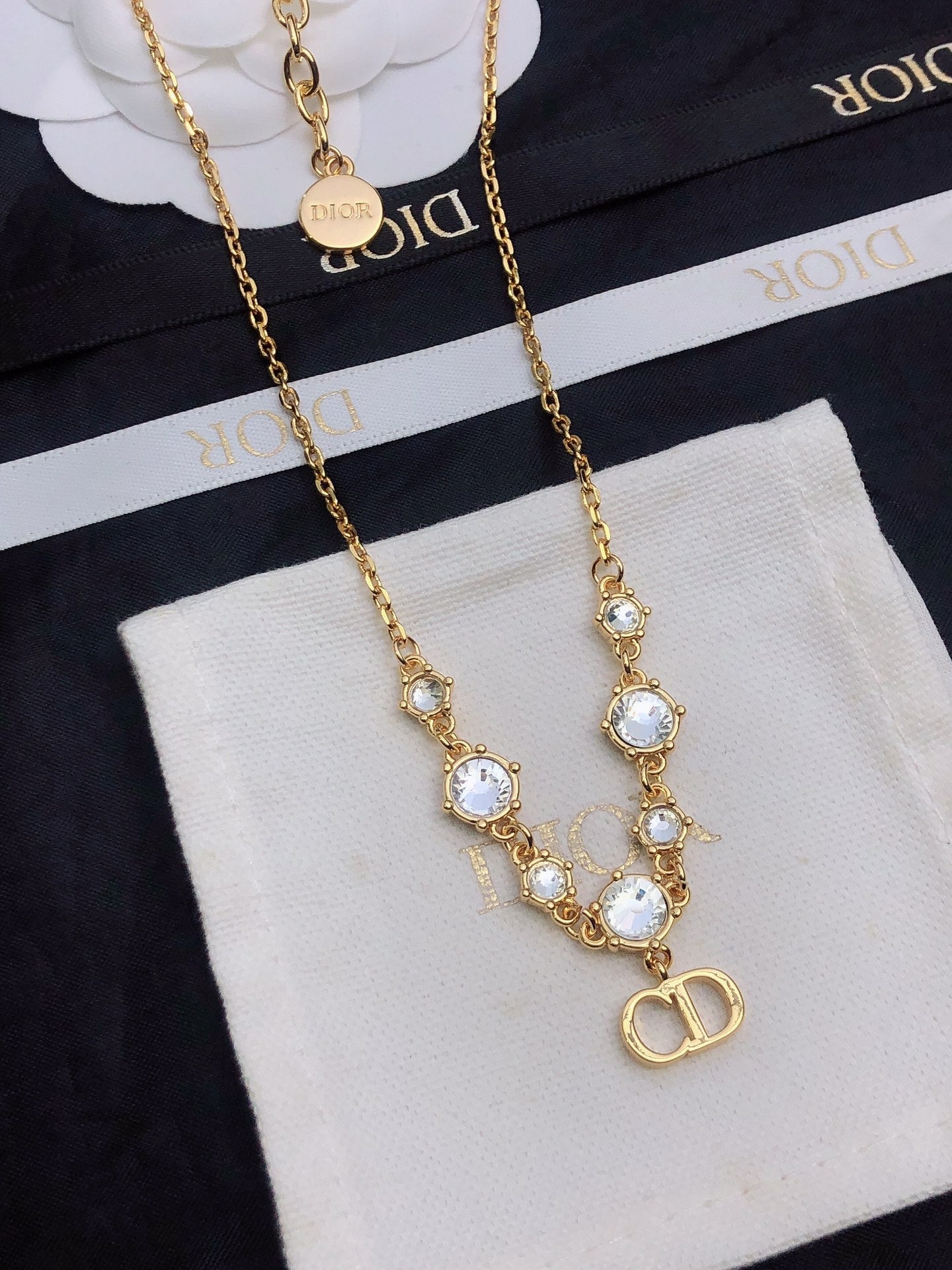 CD 26S CD LOGO CRYSTAL STATION NECKLACE IN GOLD TONE METAL WITH WHITE CRYSTAL 631006