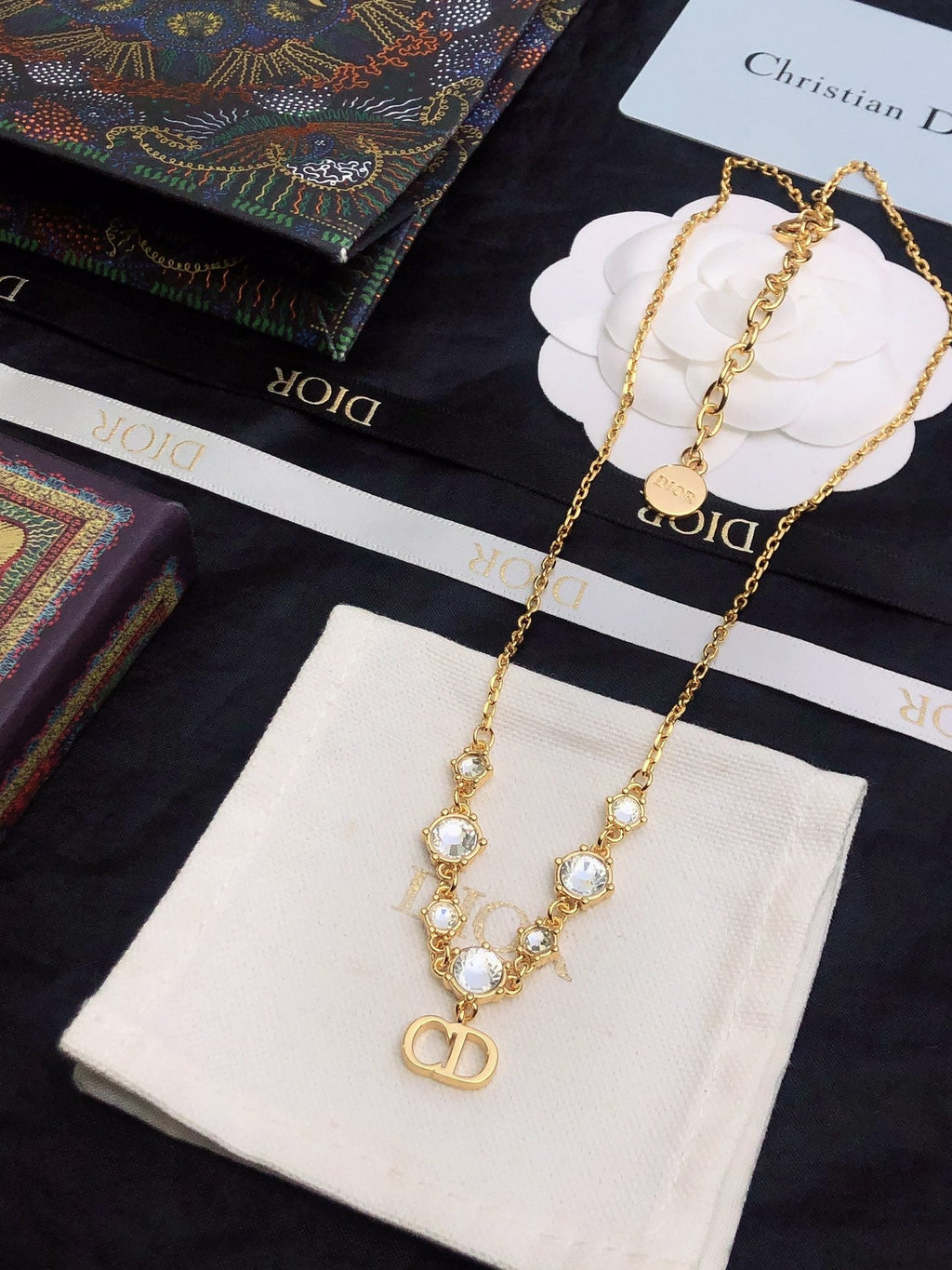 CD 26S CD LOGO CRYSTAL STATION NECKLACE IN GOLD TONE METAL WITH WHITE CRYSTAL 631006