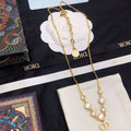 CD 26S CD LOGO CRYSTAL STATION NECKLACE IN GOLD TONE METAL WITH WHITE CRYSTAL 631006