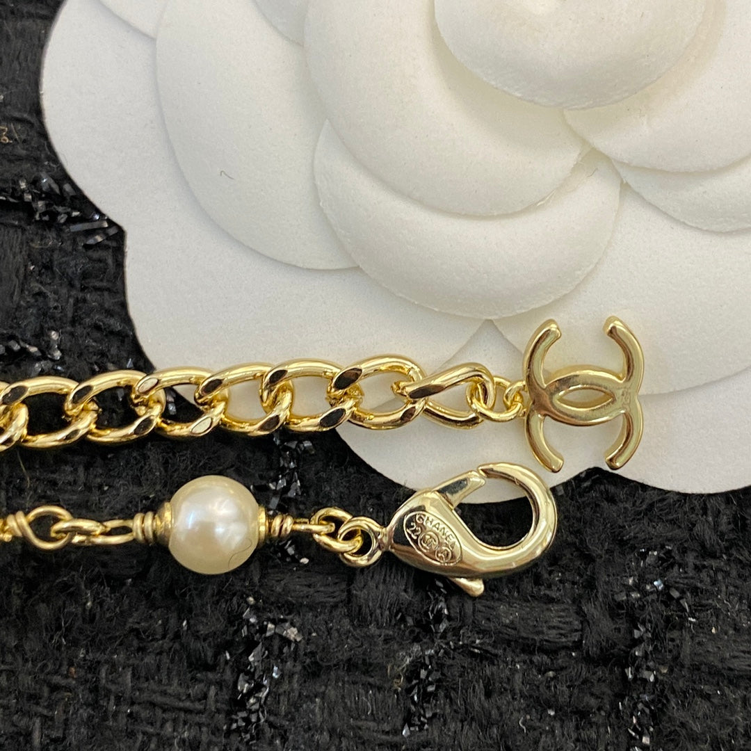 CHANEL 26S DOUBLE C LETTER PEARL NECKLACE WITH HEART CHARMS IN GOLD METAL 631850