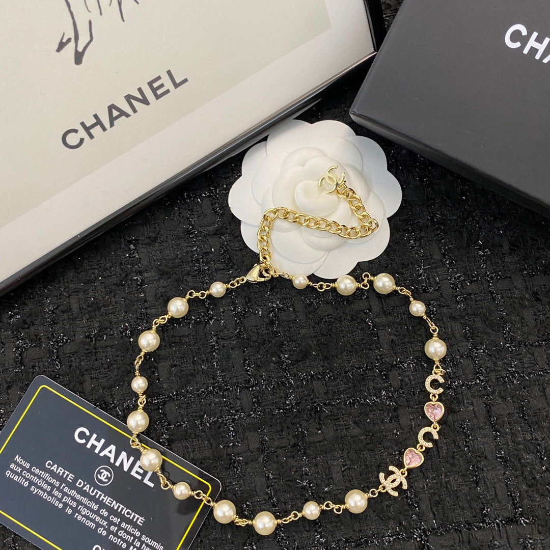 CHANEL 26S DOUBLE C LETTER PEARL NECKLACE WITH HEART CHARMS IN GOLD METAL 631850