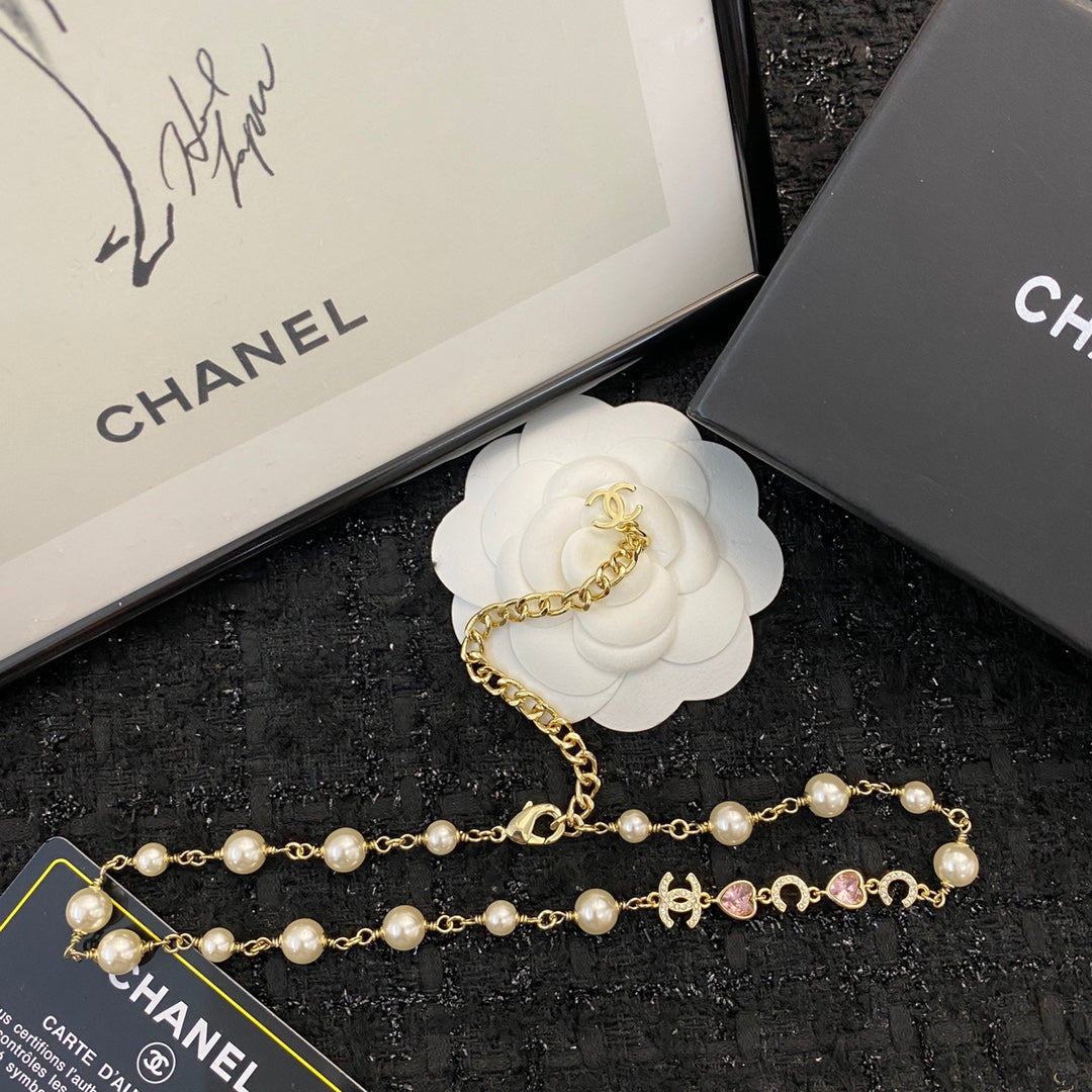 CHANEL 26S DOUBLE C LETTER PEARL NECKLACE WITH HEART CHARMS IN GOLD METAL 631850