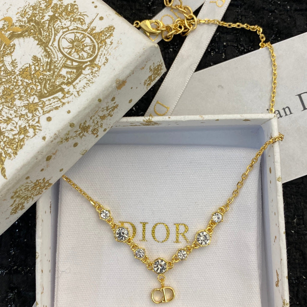 CD 26S CD LOGO CZ STATION NECKLACE IN GOLD TONE METAL 631851