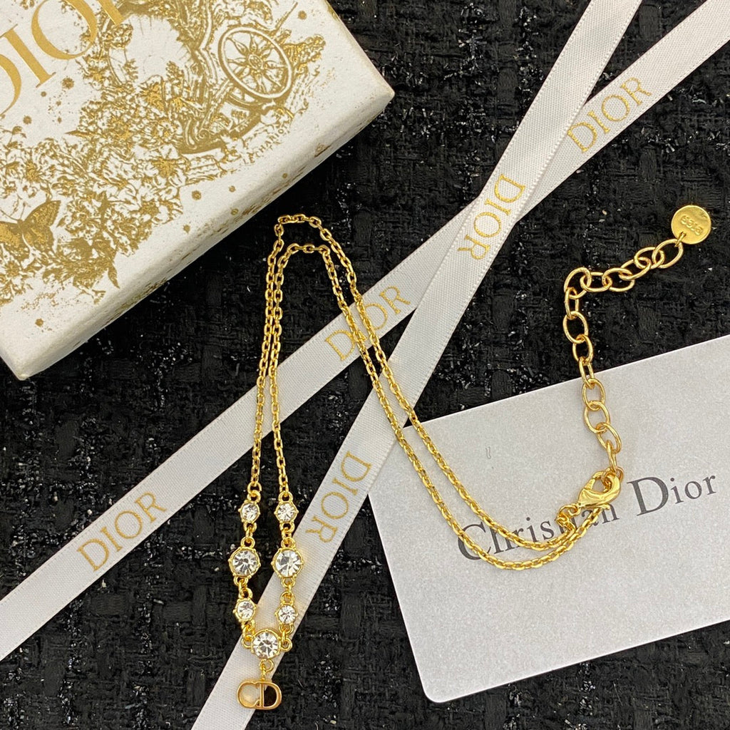 CD 26S CD LOGO CZ STATION NECKLACE IN GOLD TONE METAL 631851
