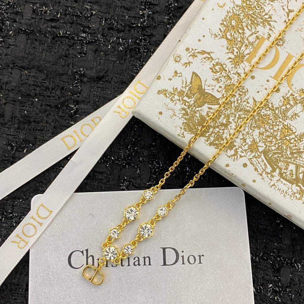 CD 26S CD LOGO CZ STATION NECKLACE IN GOLD TONE METAL 631851