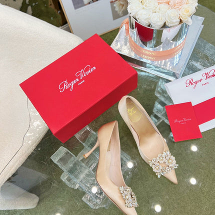 EFFLORESCENCE POINTED-TOE PUMPS IN NUDE SATIN WITH CRYSTAL BUCKLE
