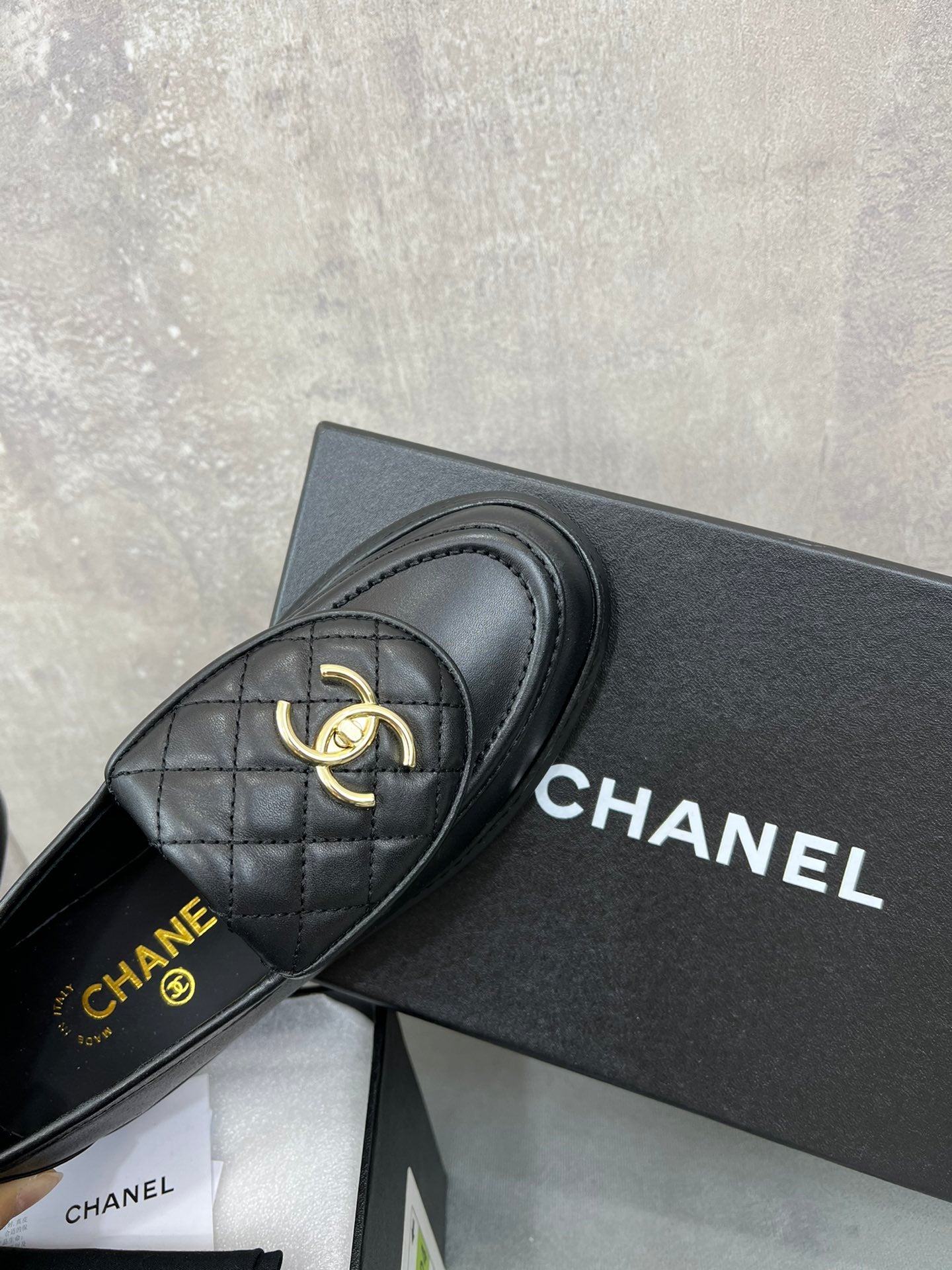 CHANEL 26S LOAFERS IN BLACK QUILTED CALFSKIN WITH CC LOGO