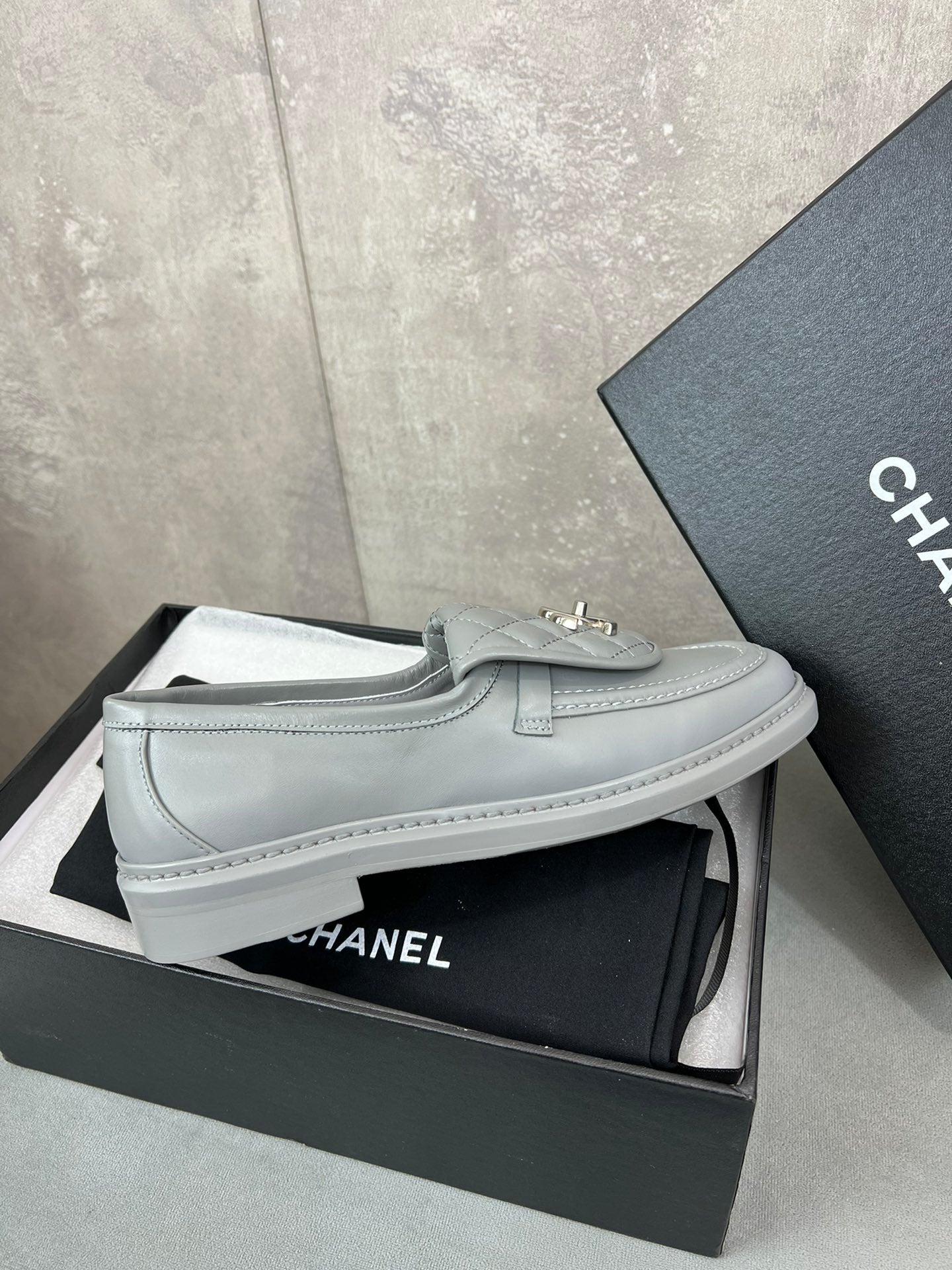 CHANEL 26S LOAFERS IN GREY QUILTED CALFSKIN WITH CC LOGO