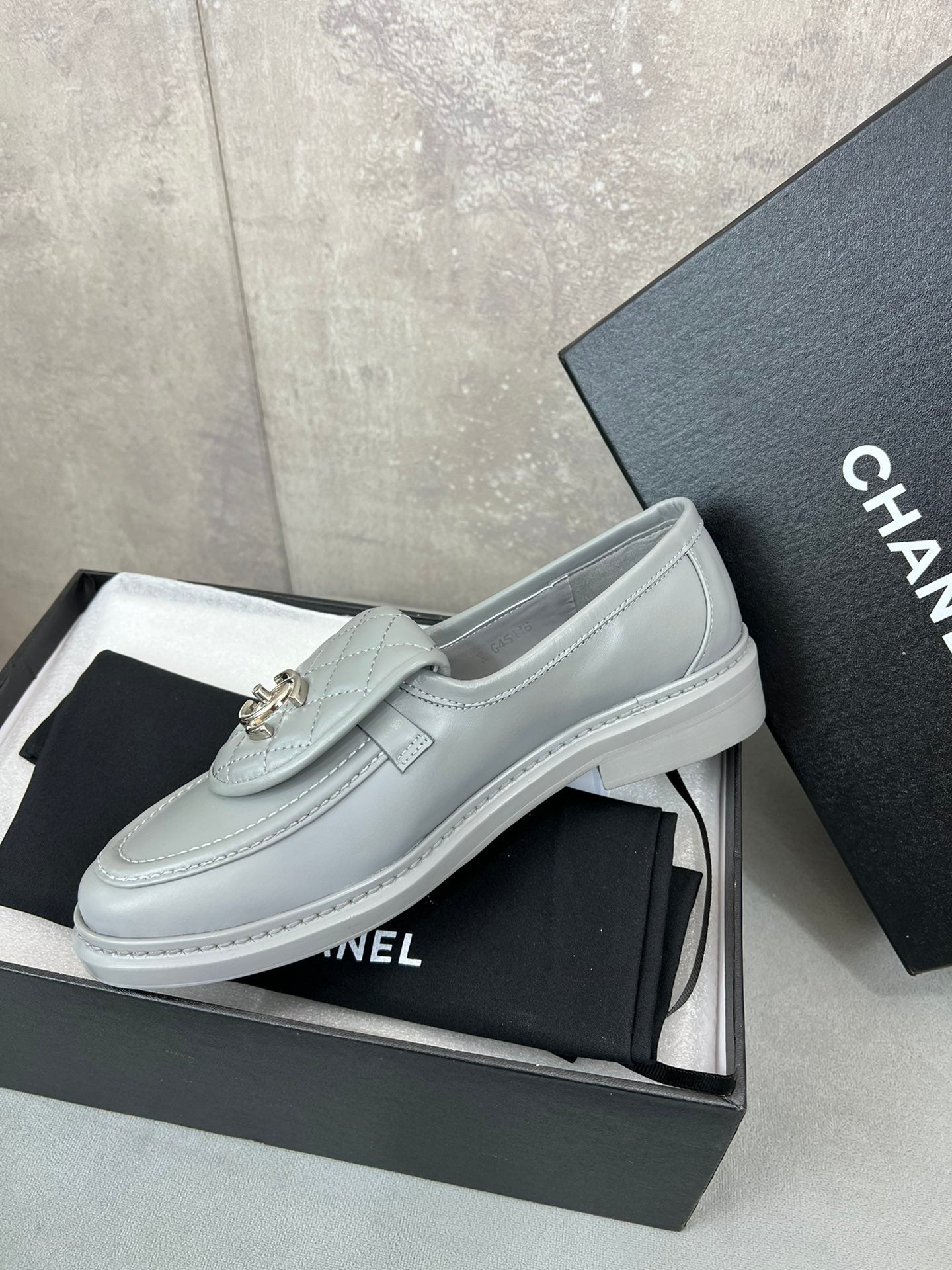 CHANEL 26S LOAFERS IN GREY QUILTED CALFSKIN WITH CC LOGO