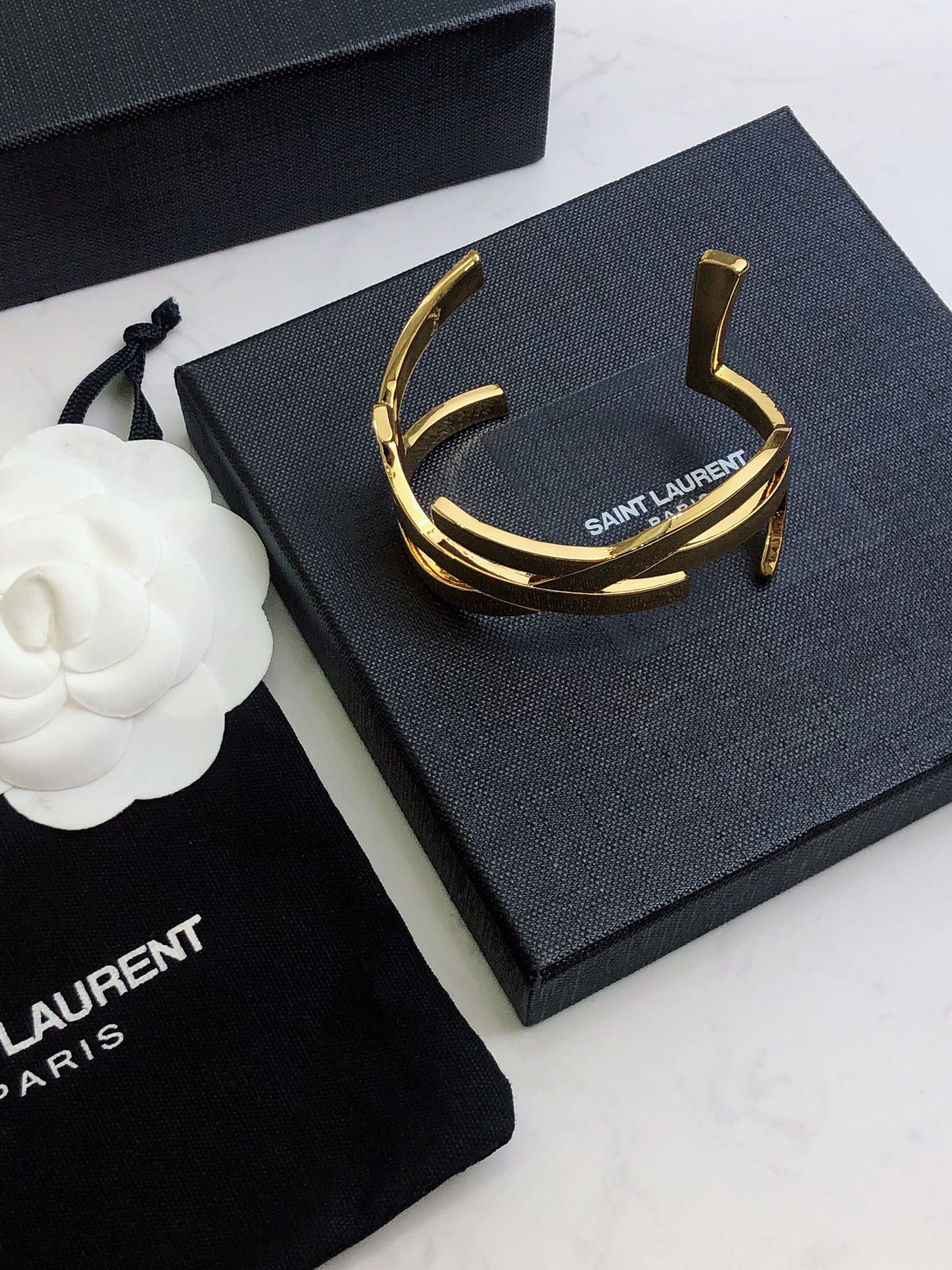 YSL 26S CRISS CROSS OPEN CUFF BRACELET IN GOLD TONE METAL 635064