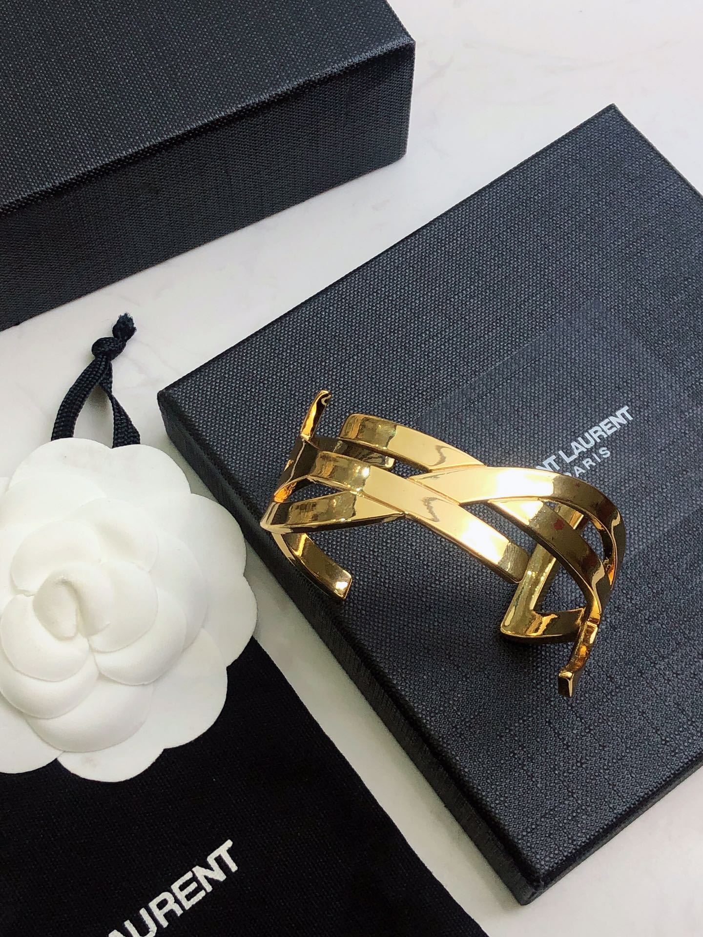 YSL 26S CRISS CROSS OPEN CUFF BRACELET IN GOLD TONE METAL 635064